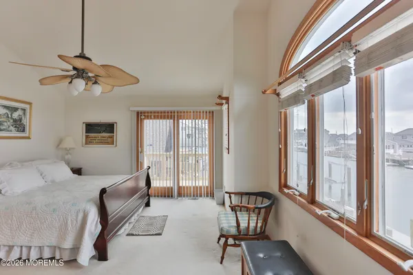 a bedroom with furniture and windows