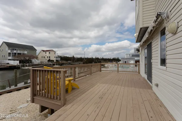 a view of a balcony with wooden floor