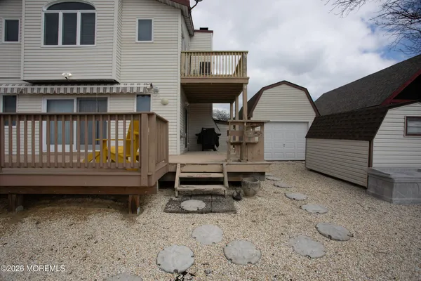 a front view of a house with a wooden deck