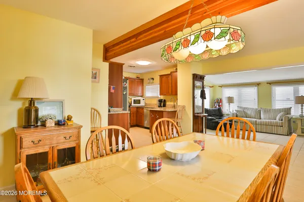 a kitchen with a table and chairs