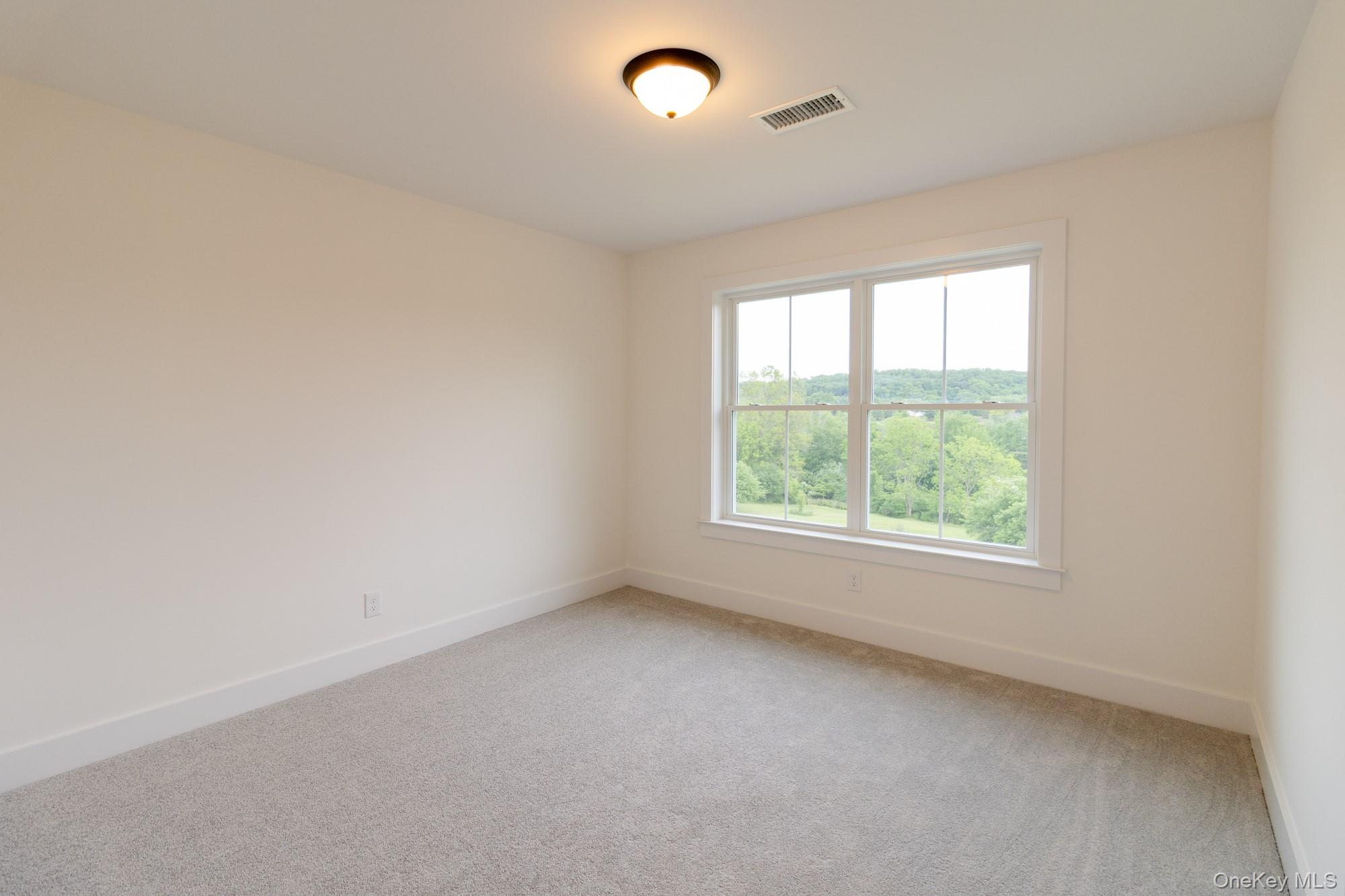 750 Ridgebury Road Slate Hill, NY 10973 - Photo 37 of 41 an empty room with a window
