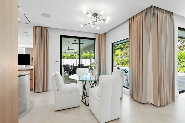 a spacious bedroom with a bed and a window