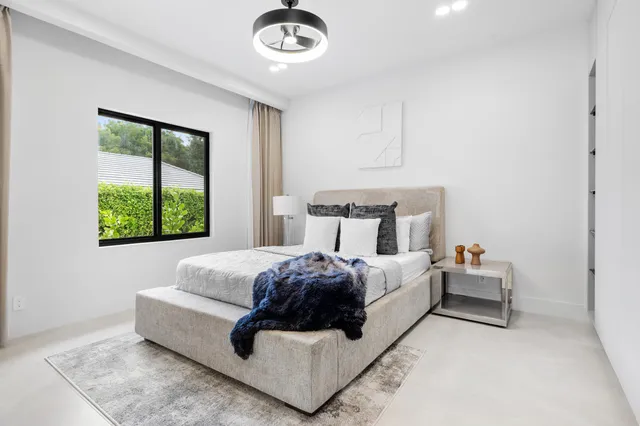 an aerial view of a house with garden space and street view