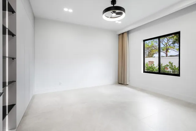 an aerial view of residential houses with outdoor space and street view