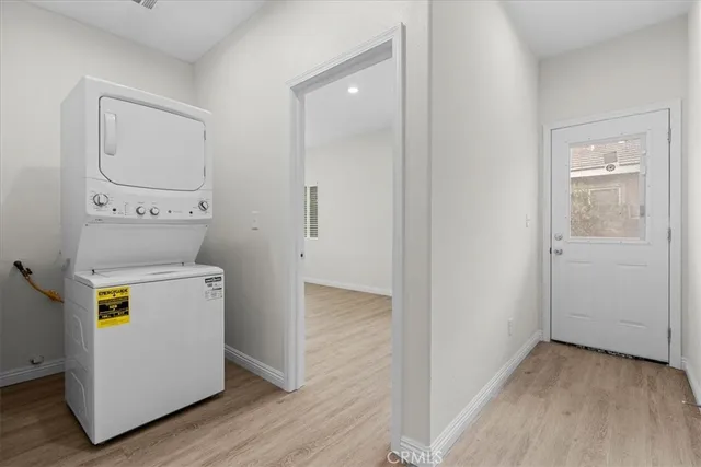 a utility room with cabinets washer and dryer