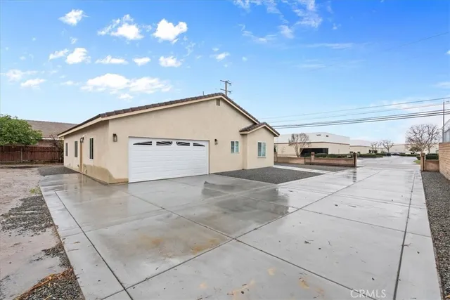 a view of house with yard