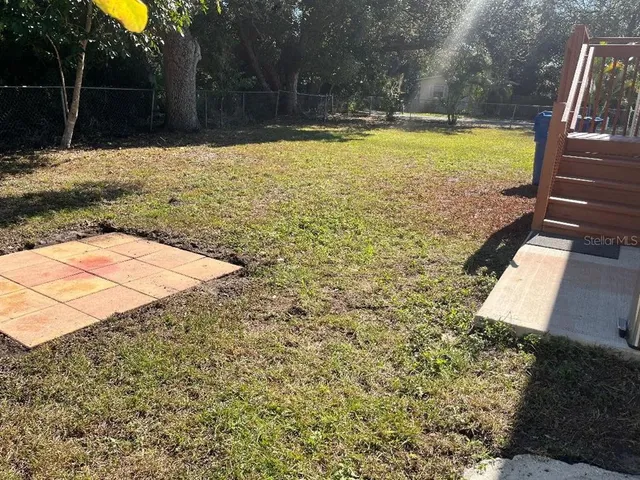a view of swimming pool with a yard