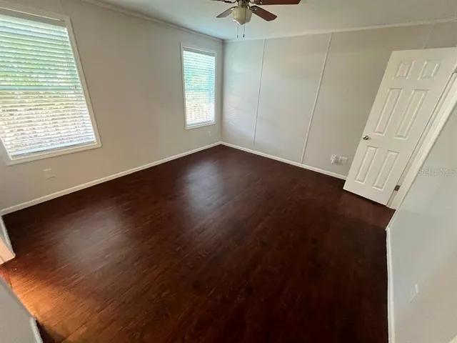 a view of room with window and hardwood floor