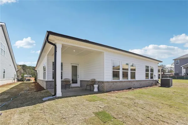 a view of a house with a backyard