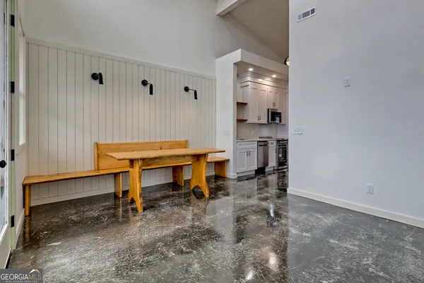 a kitchen with a sink and refrigerator
