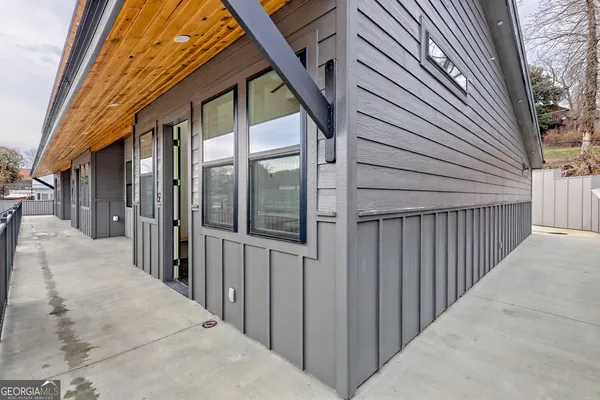 a kitchen with stainless steel appliances granite countertop a refrigerator sink and stove