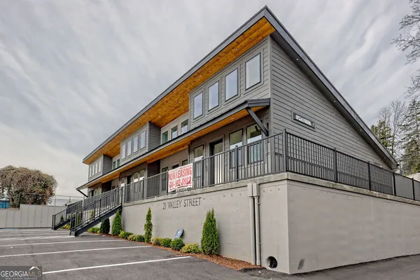 a view of a house with a street