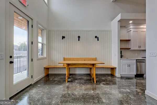a kitchen with stainless steel appliances granite countertop a refrigerator and a stove