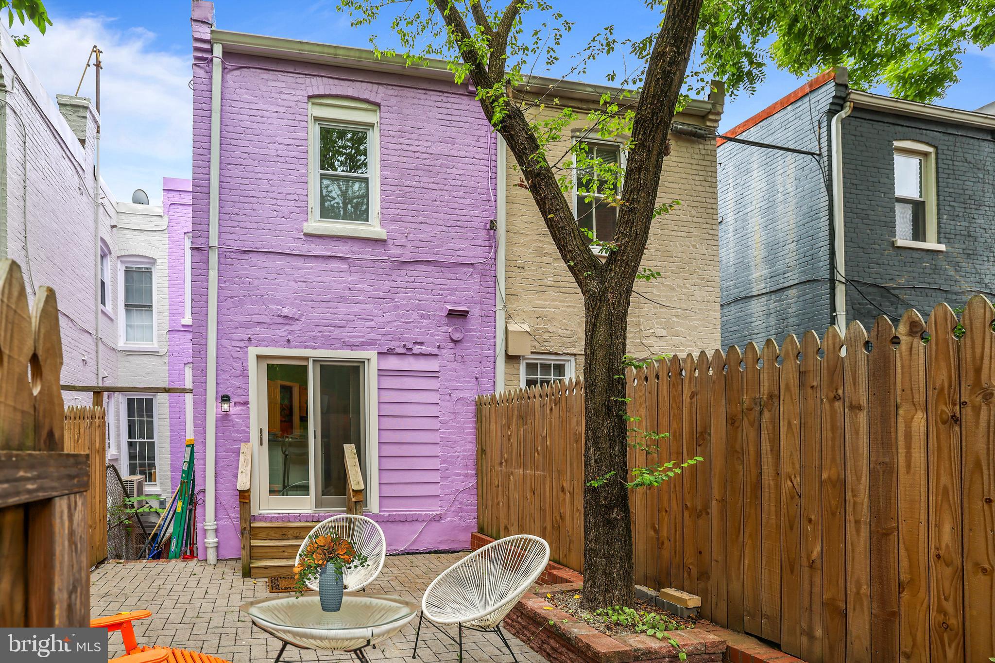 1215 33rd Street Northwest Washington, DC 20007 - Photo 33 of 37 a backyard of a house with table and chairs