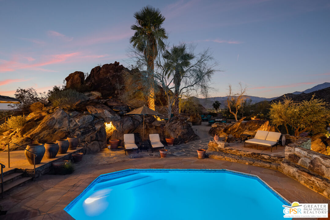 252 Ridge Road Palm Springs, CA 92264 - Photo 5 of 53 a view of a swimming pool with an outdoor space and seating area