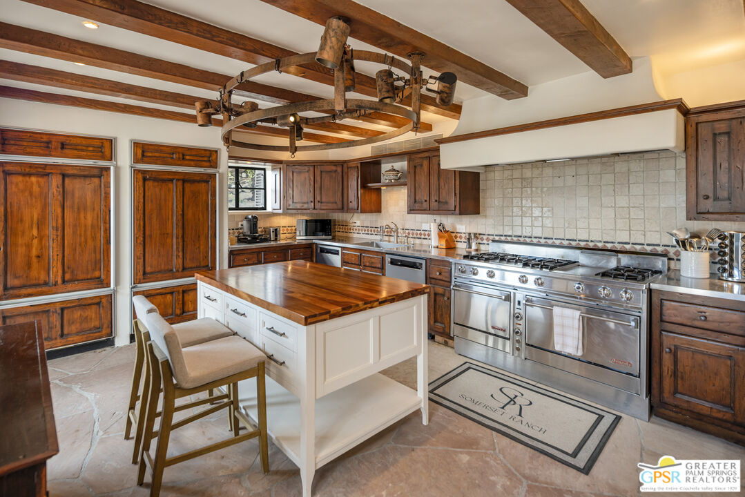 252 Ridge Road Palm Springs, CA 92264 - Photo 9 of 53 a kitchen with a stove a sink and a refrigerator