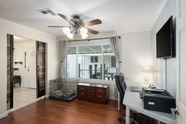 a bedroom with a bed and a couch