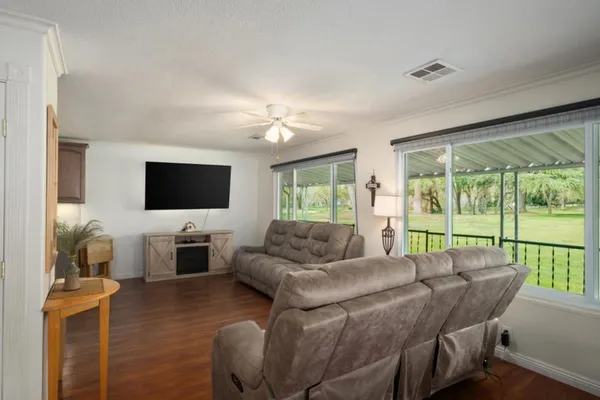 a kitchen with a sink cabinets and dining table chair