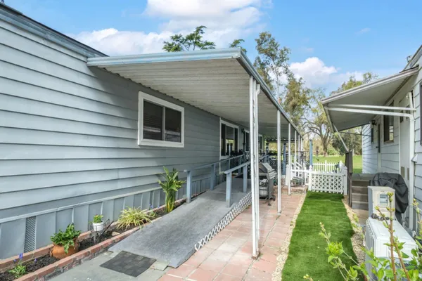 a view of a porch with furniture