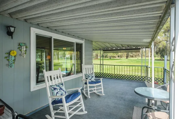 a view of room with cabinet and flat screen tv