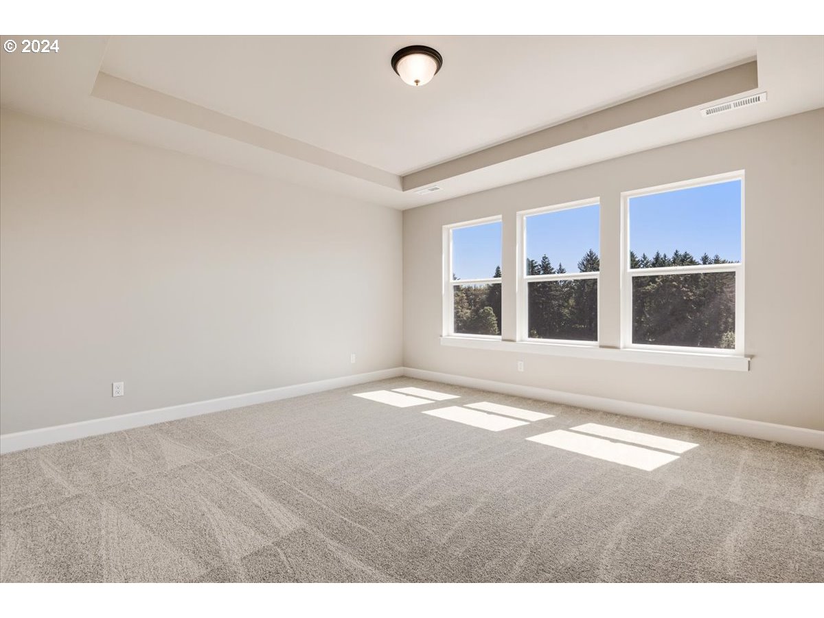 18050 Southwest Barrows Road Beaverton, OR 97007 - Photo 20 of 45 a view of an empty room with a window