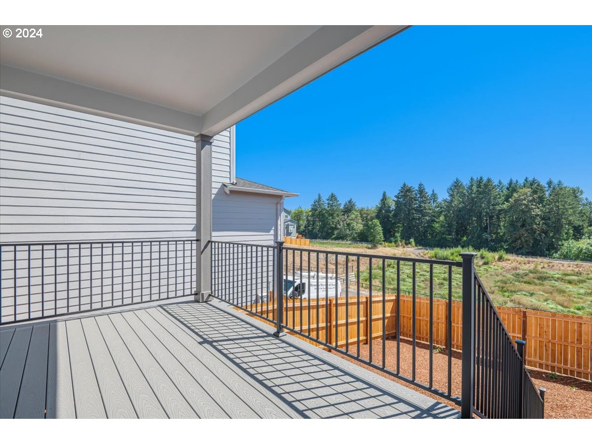 18050 Southwest Barrows Road Beaverton, OR 97007 - Photo 27 of 45 a view of balcony with wooden floor and fence