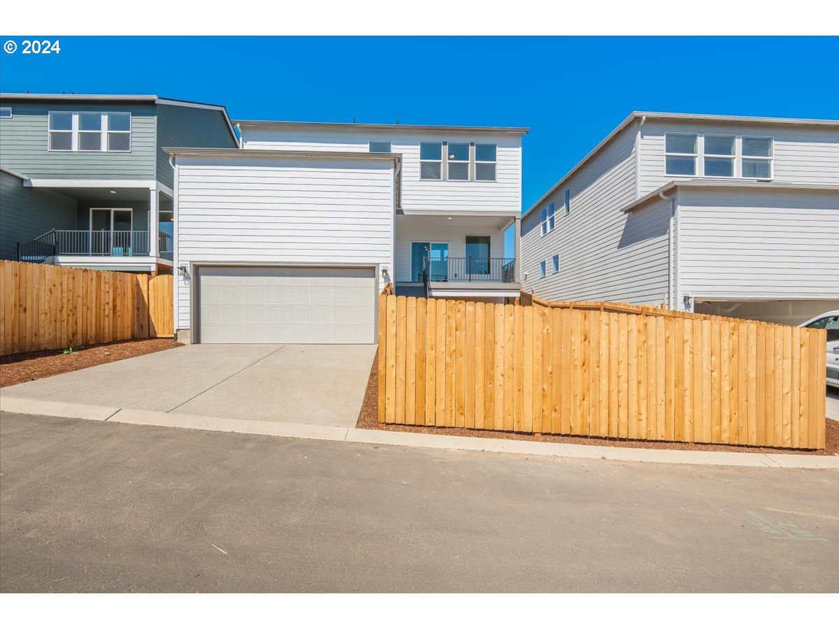18050 Southwest Barrows Road Beaverton, OR 97007 - Photo 32 of 45 a front view of a house with a garage