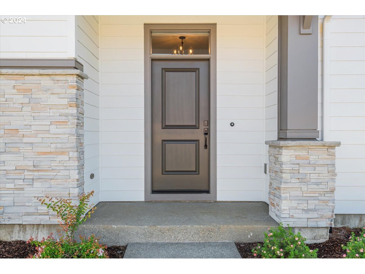 18050 Southwest Barrows Road Beaverton, OR 97007 - Photo 4 of 45 a view of a hallway with entryway and front door