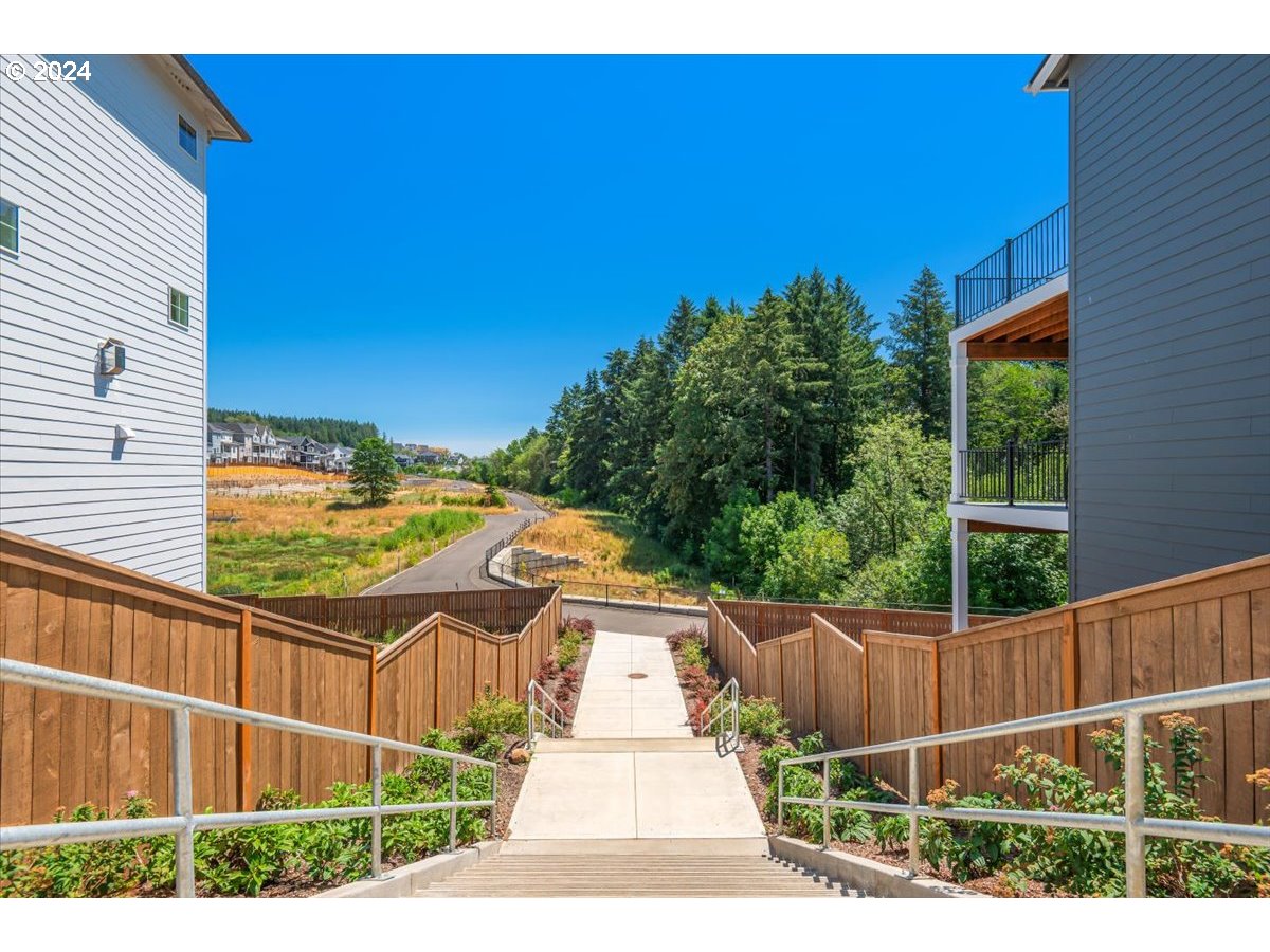 18050 Southwest Barrows Road Beaverton, OR 97007 - Photo 42 of 45 a view of a balcony with floor to ceiling windows and wooden fence
