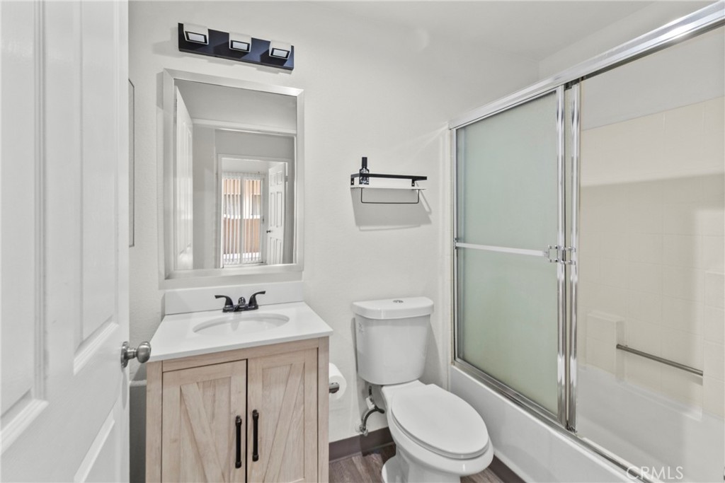 19350 Sherman Way, Unit 125 Reseda, CA 91335 - Photo 11 of 20 a white toilet sitting next to a bathroom sink