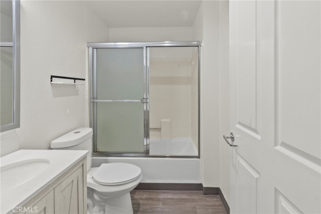 19350 Sherman Way, Unit 125 Reseda, CA 91335 - Photo 13 of 20 a bathroom with a sink a toilet and shower