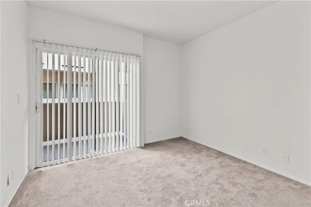 a view of a hallway with washer and dryer