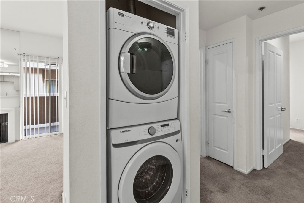 19350 Sherman Way, Unit 125 Reseda, CA 91335 - Photo 15 of 20 a view of a hallway with washer and dryer