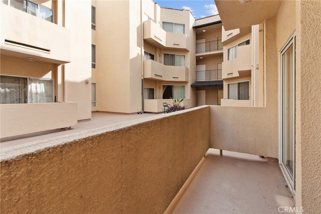 19350 Sherman Way, Unit 125 Reseda, CA 91335 - Photo 16 of 20 a view of a building with a outdoor space