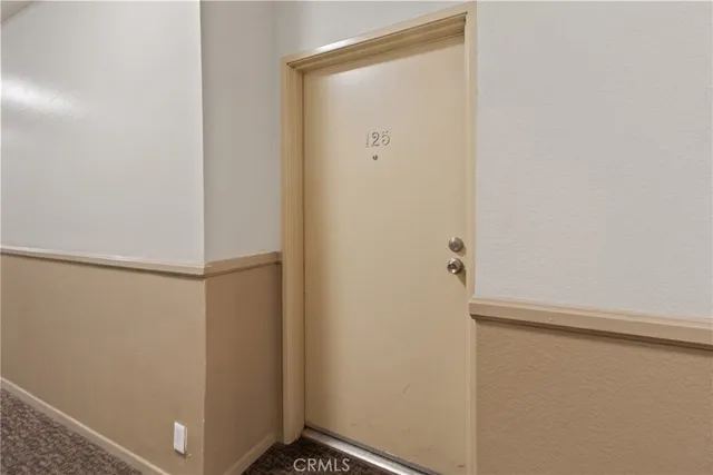 a view of a swimming pool with a patio and a yard