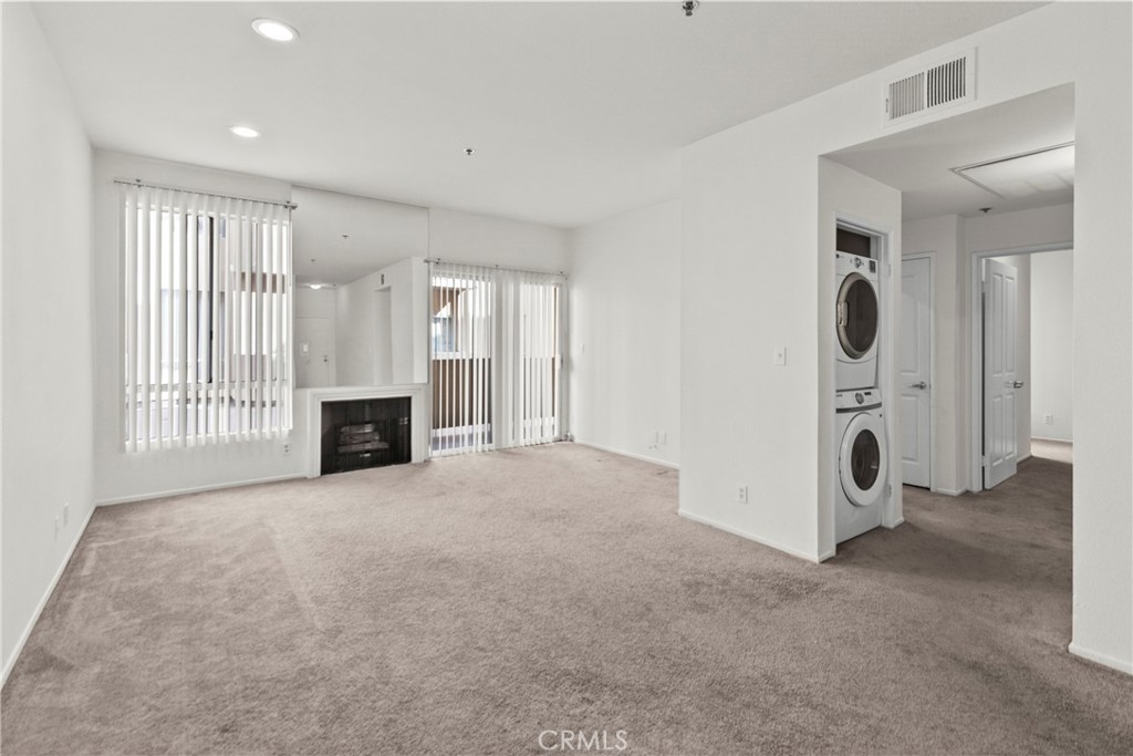 19350 Sherman Way, Unit 125 Reseda, CA 91335 - Photo 3 of 20 an entryway with livingroom and fireplace