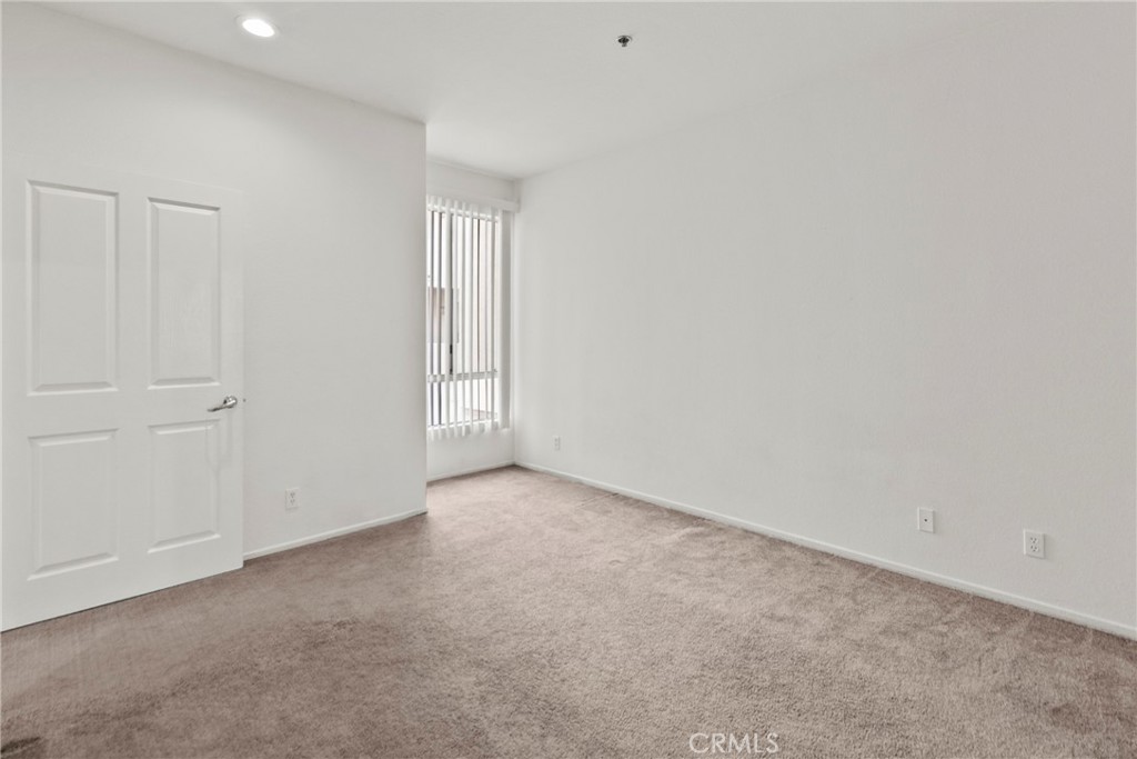 19350 Sherman Way, Unit 125 Reseda, CA 91335 - Photo 10 of 20 a view of an empty room and entryway