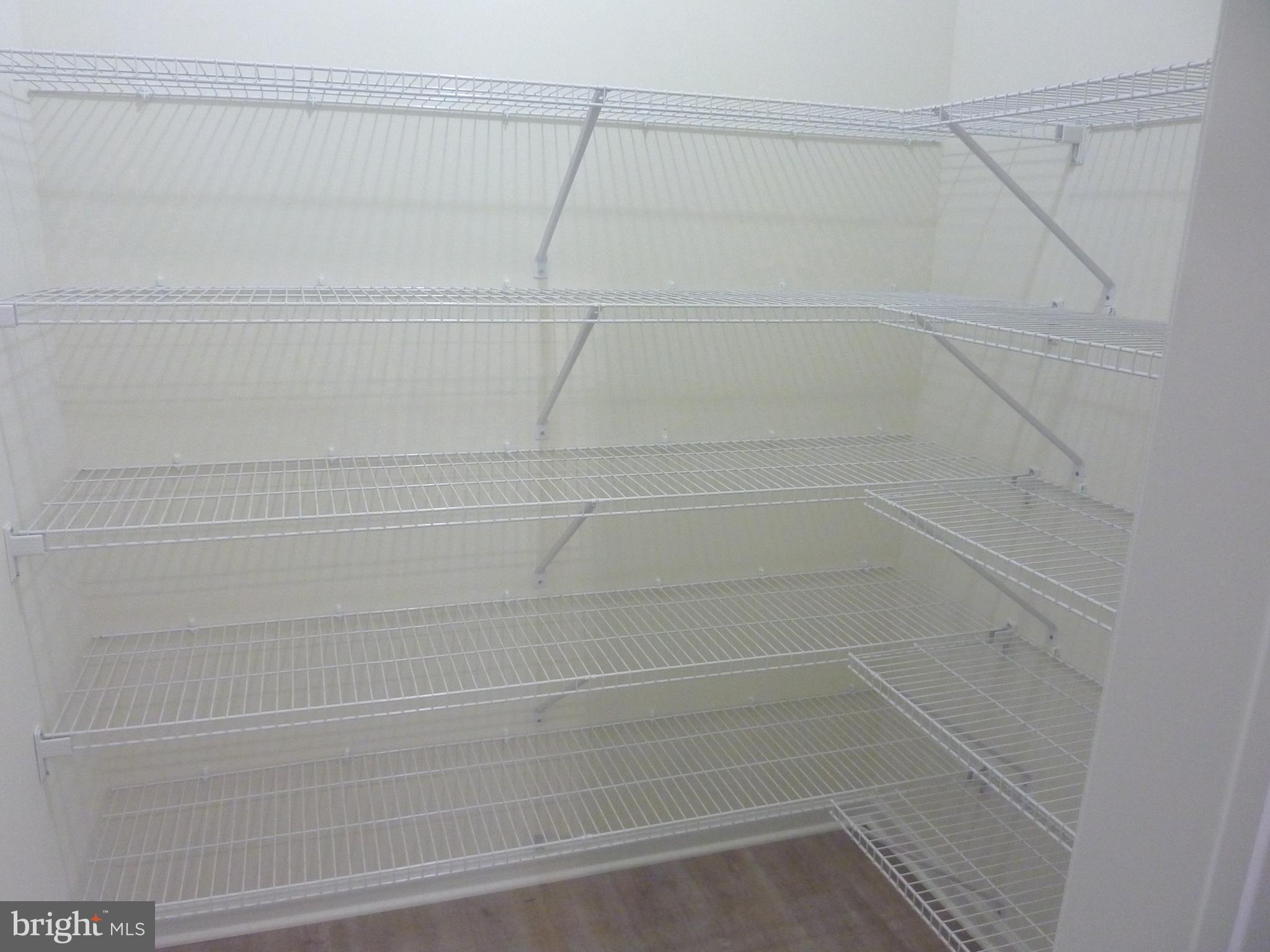 106 Parma Drive Clayton, DE 19938 - Photo 15 of 51 a view of a room with racks on the wall