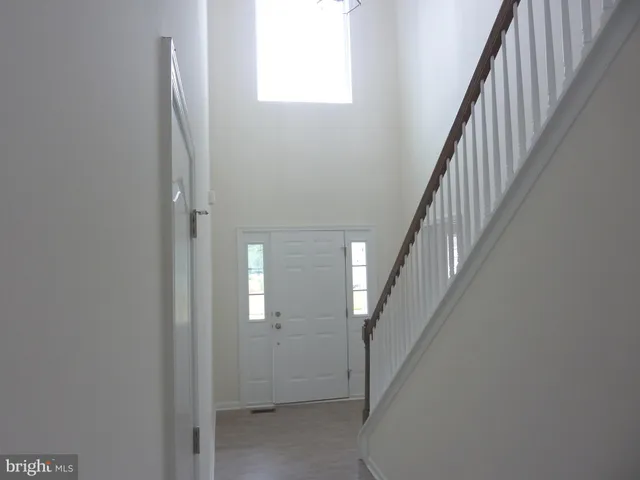 a view of a hallway with staircase
