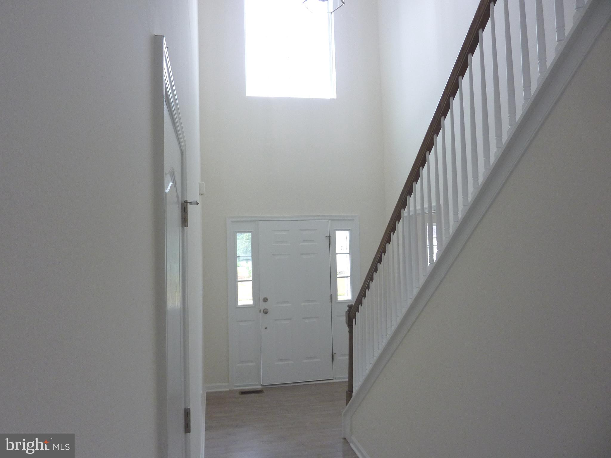 106 Parma Drive Clayton, DE 19938 - Photo 2 of 51 a view of a hallway with staircase