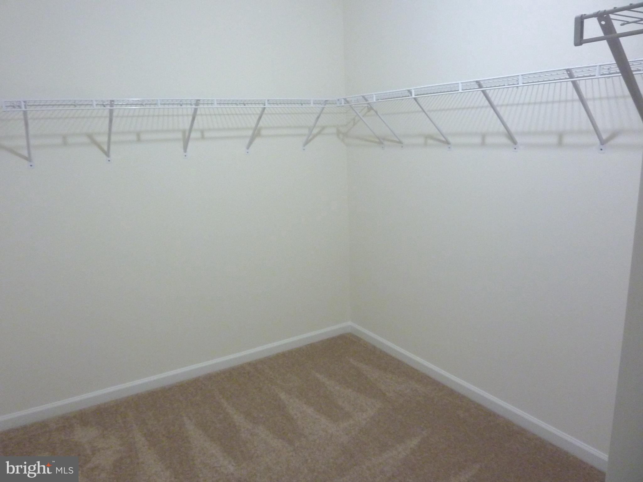 106 Parma Drive Clayton, DE 19938 - Photo 29 of 51 a view of a room with racks on the wall