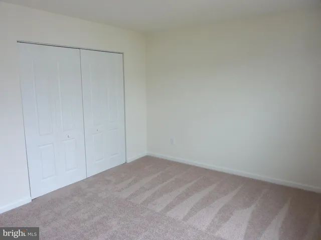 a bathroom with a sink toilet and a window