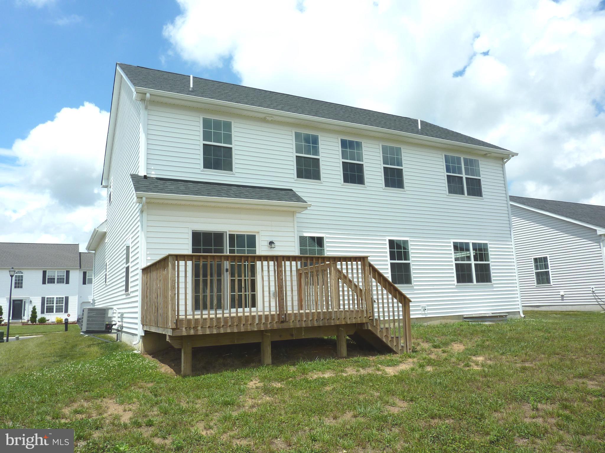 106 Parma Drive Clayton, DE 19938 - Photo 50 of 51 a view of a house with a wooden deck