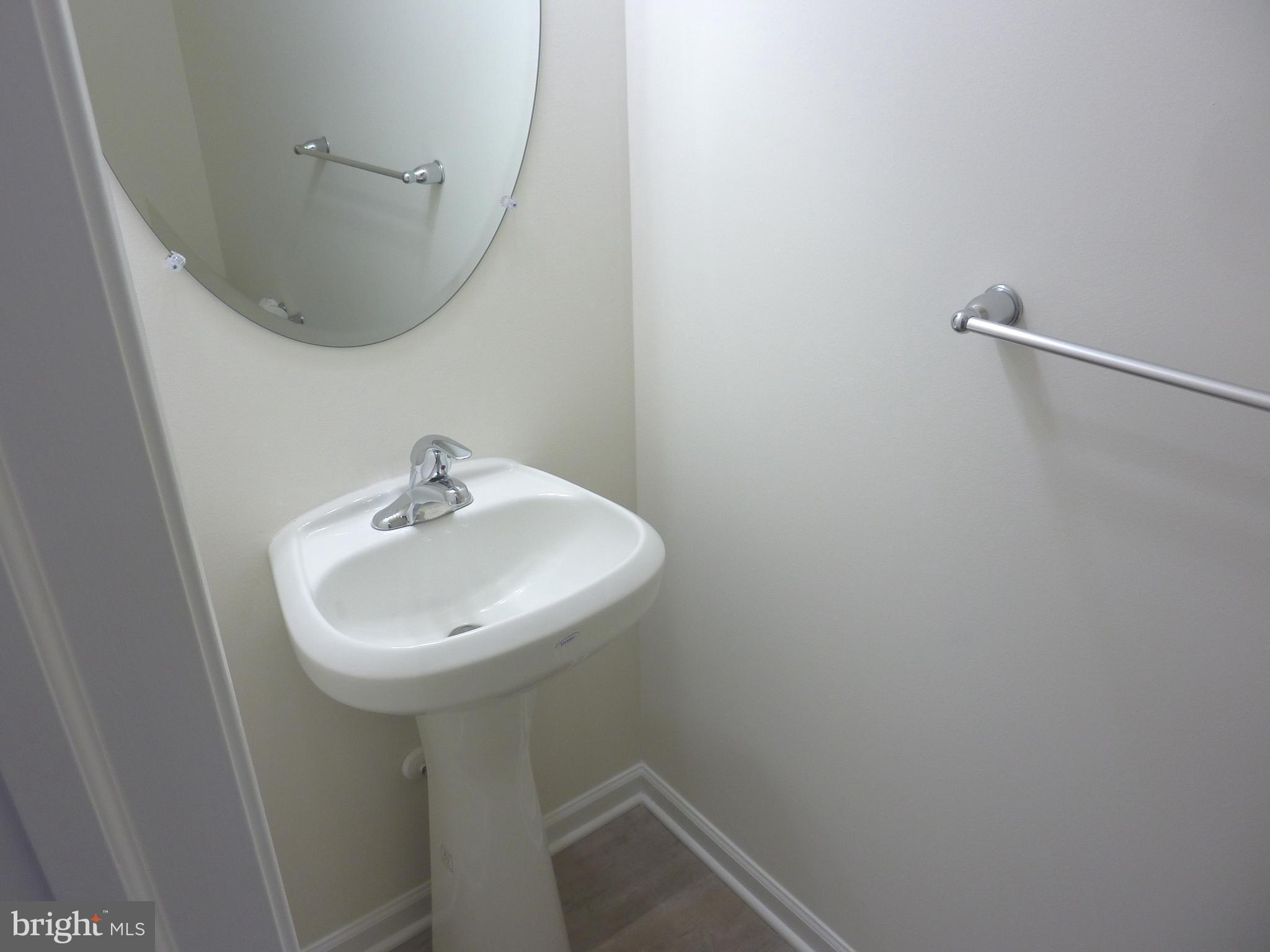 106 Parma Drive Clayton, DE 19938 - Photo 6 of 51 a sink and a mirror