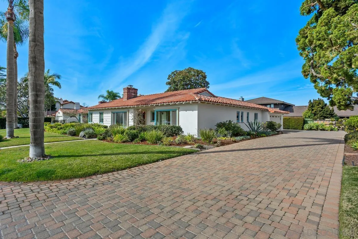 6138 La Flecha Rancho Santa Fe, CA 92067 - Photo 14 of 14 a front view of a house with a yard and potted plants
