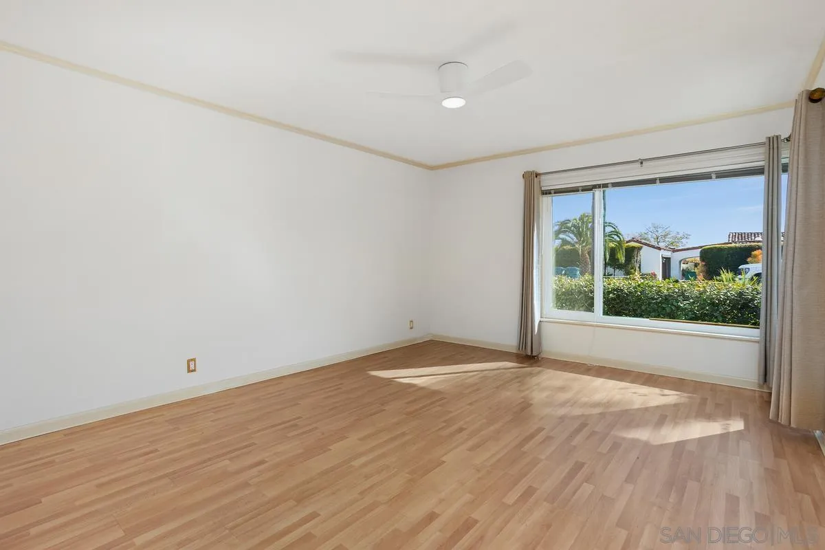 6138 La Flecha Rancho Santa Fe, CA 92067 - Photo 6 of 14 a view of an empty room with wooden floor and a window