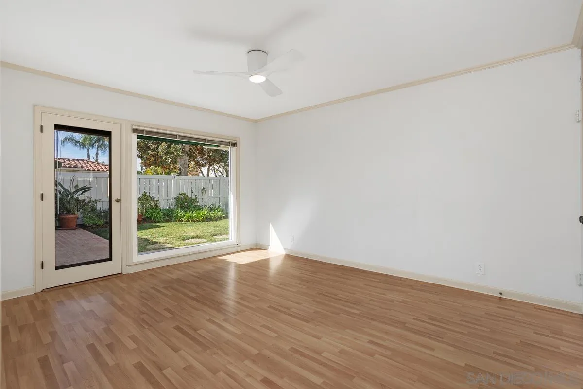6138 La Flecha Rancho Santa Fe, CA 92067 - Photo 9 of 14 a view of an empty room with wooden floor and a window