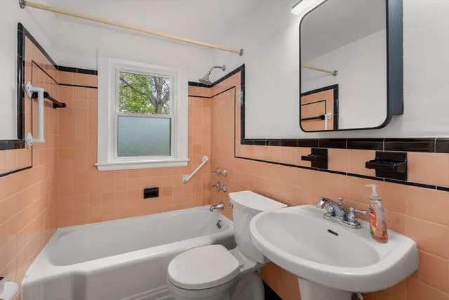 a bathroom with a toilet a sink and a bathtub