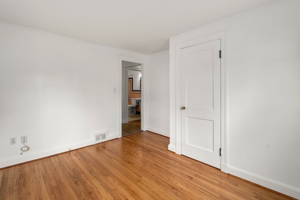 46 Bayard Street Dedham, MA 02026 - Photo 20 of 34 a view of an empty room with wooden floor