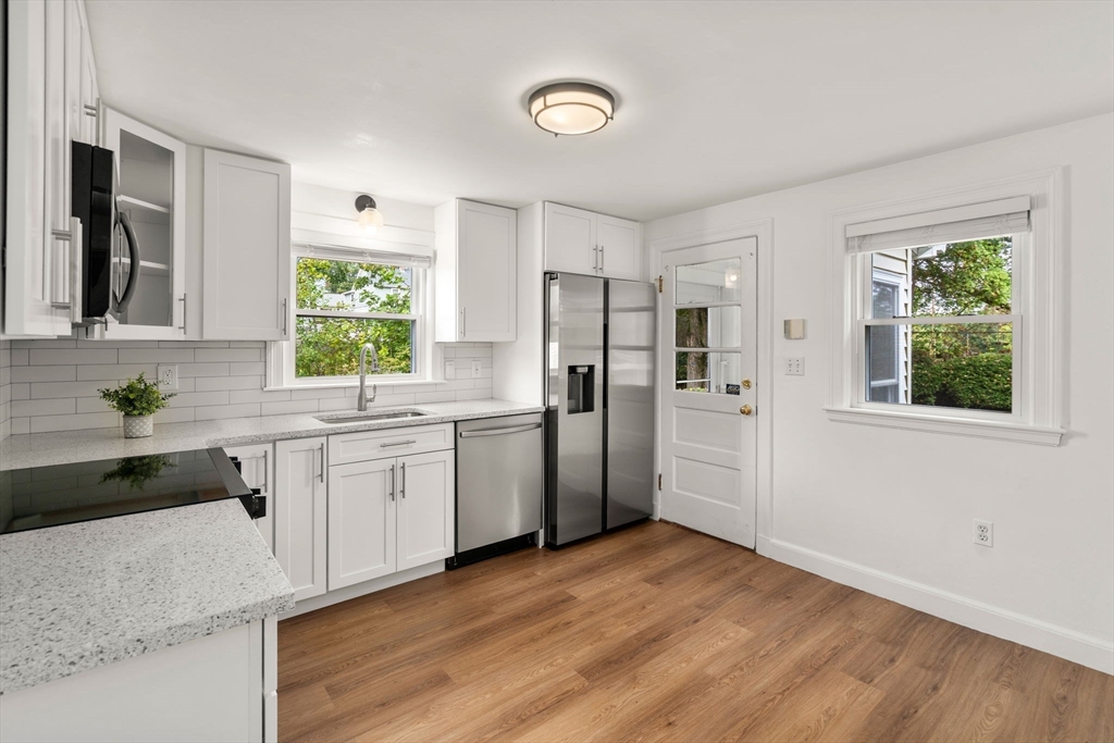 46 Bayard Street Dedham, MA 02026 - Photo 2 of 34 a kitchen with a refrigerator and a sink